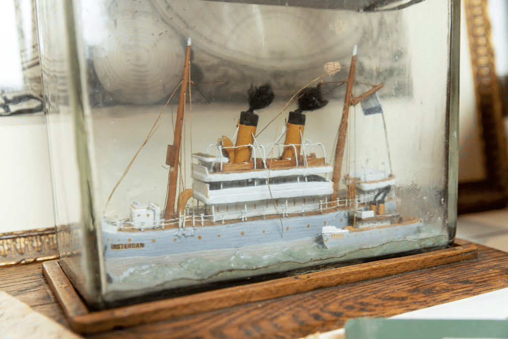 Ship in a bottle: model of a steamship in a glass case, close-up
