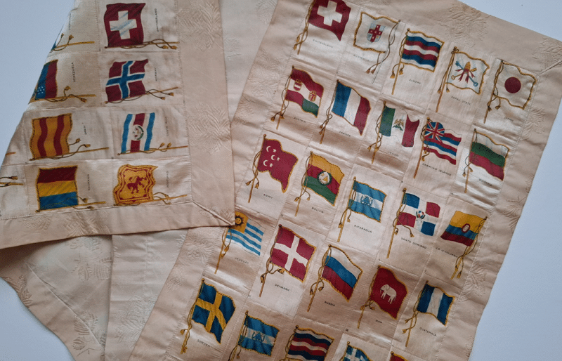 Detail of the silk table runner with flags of European countries